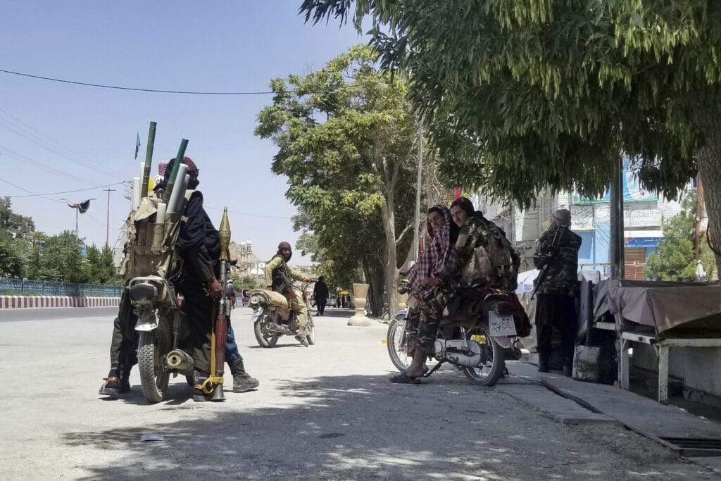 Taliban fighters patrol inside the city of Ghazni, southwest of Kabul, Afghanistan,