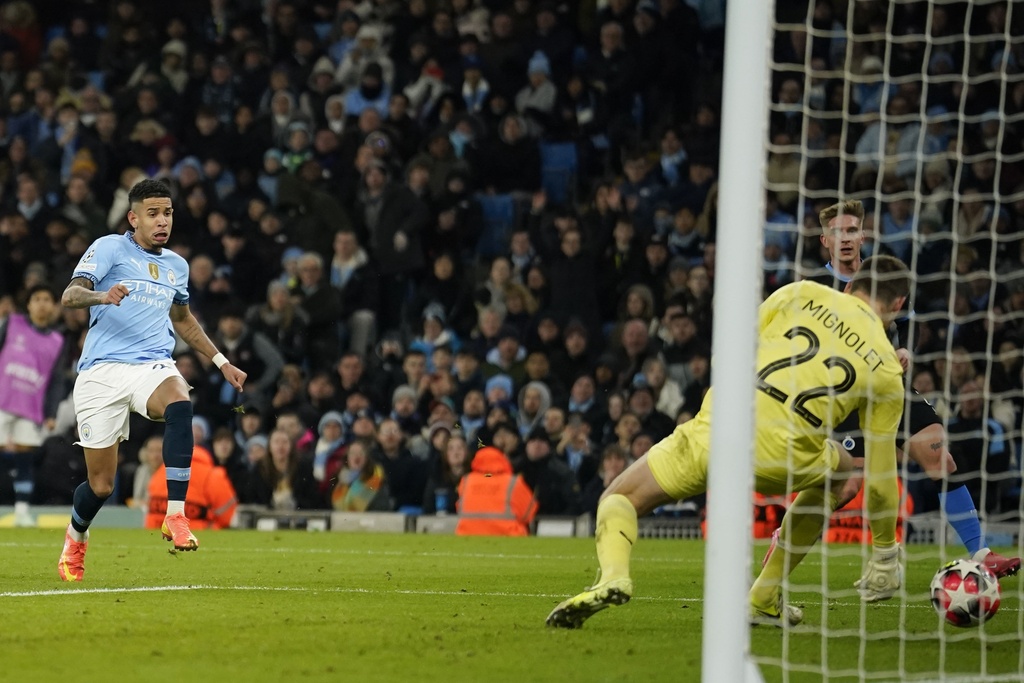 Man City Survives Scare to Reach Champions League Knockouts