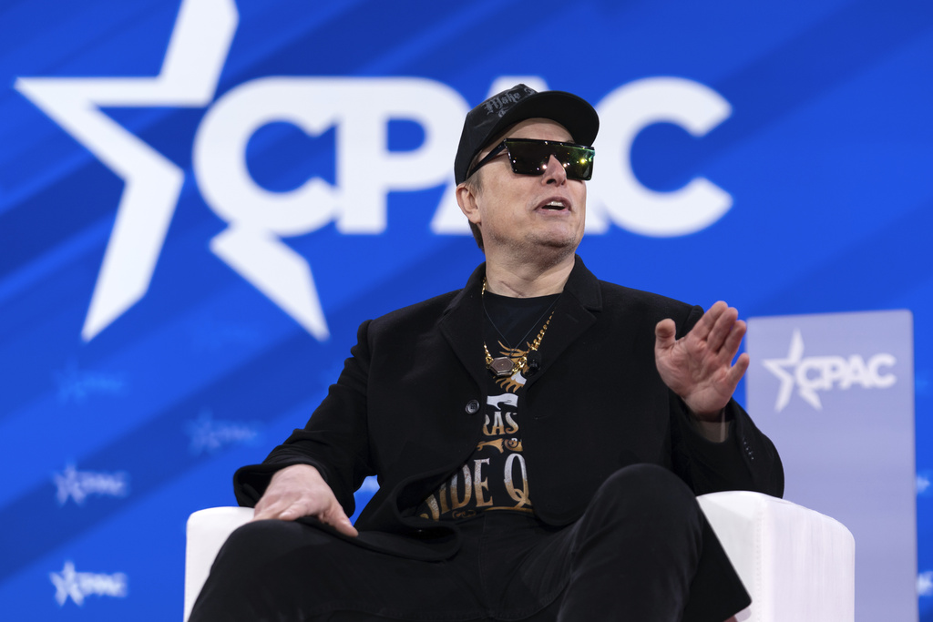 Elon Musk Wields Chainsaw, Slams Democrats at CPAC Event